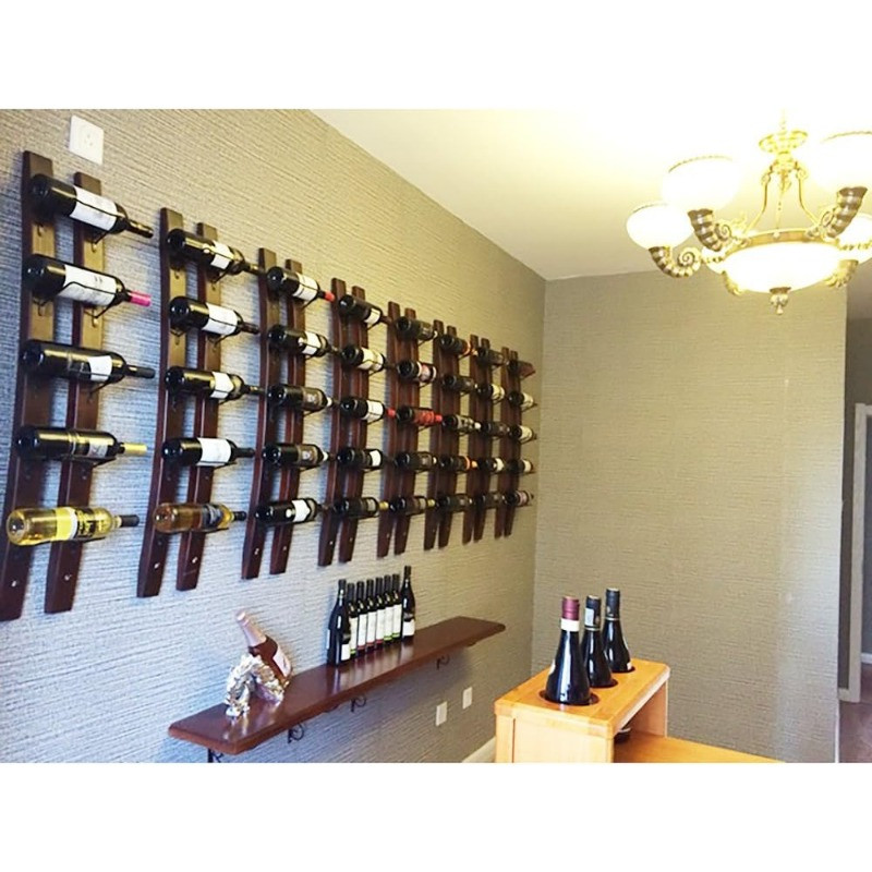 Wine racks on a beige wall with chandelier